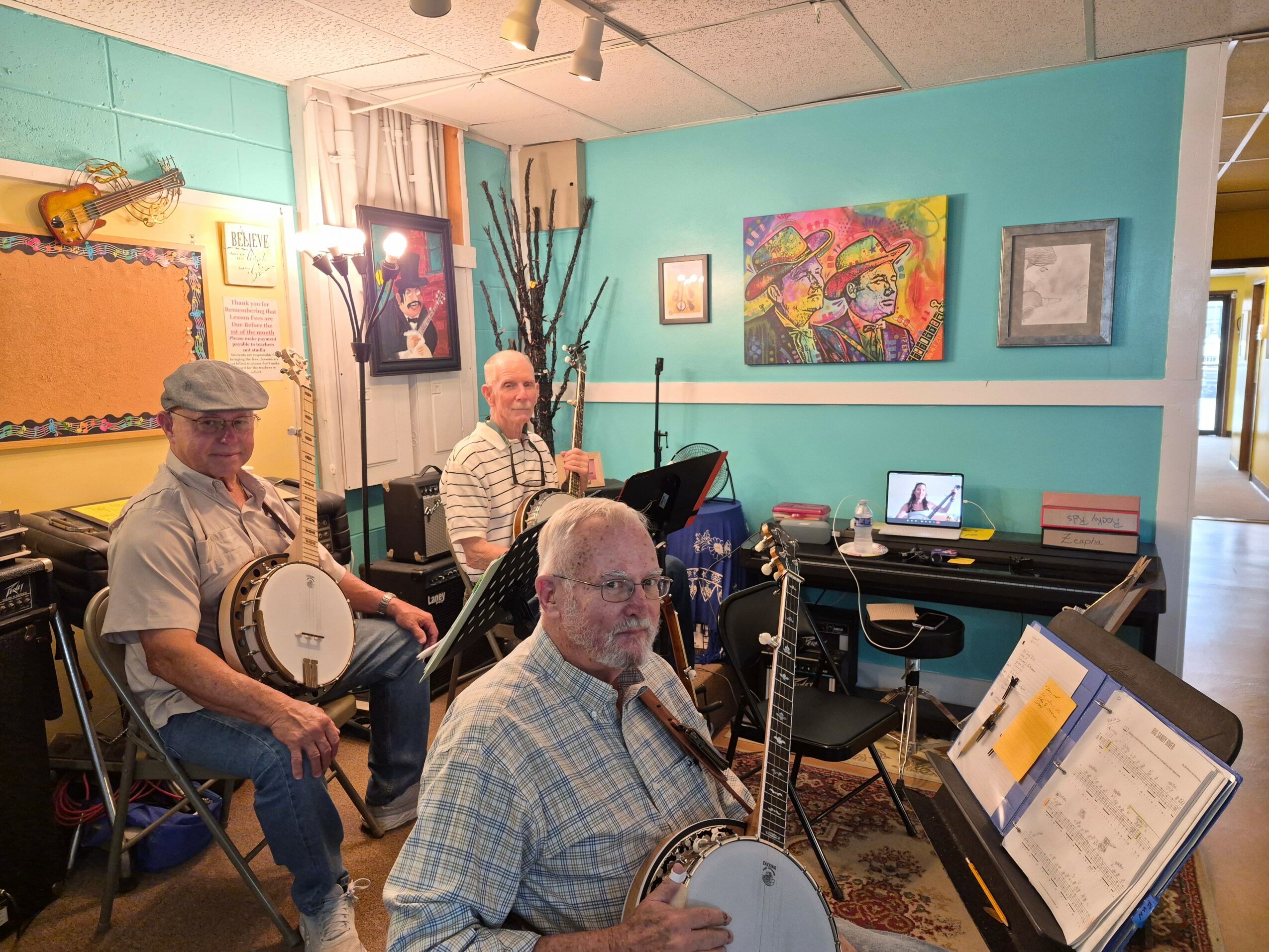Three musicians with instruments in a room, one at a piano, one with a drum, and one with a clarinet.