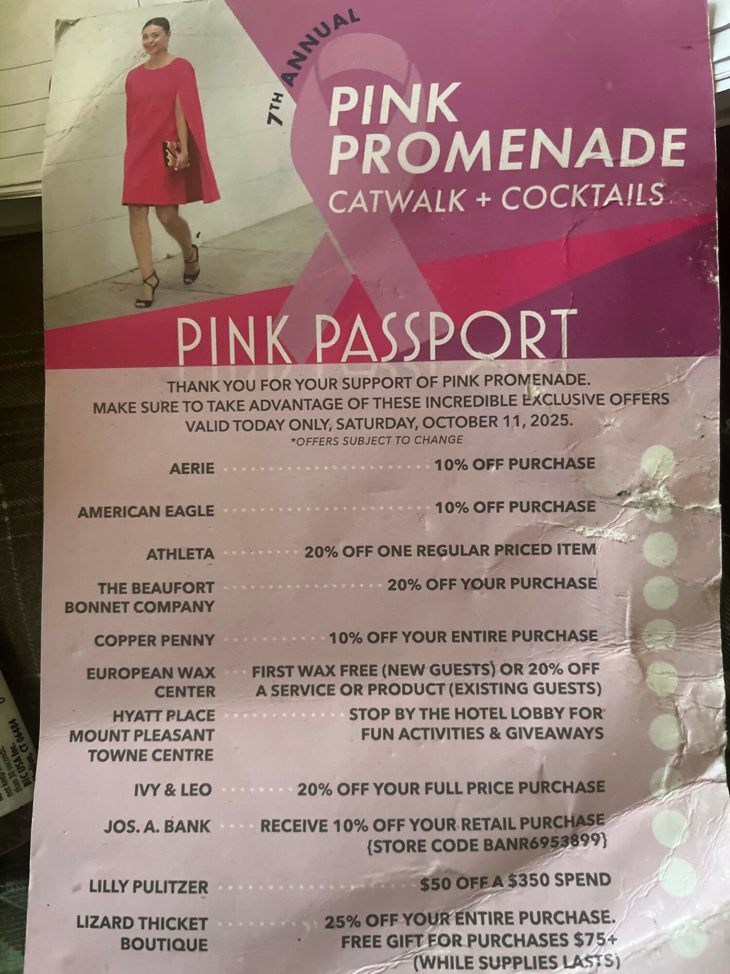 Pink and white event ticket with a woman in a red dress, text about Pink Menade event, and details about the event.