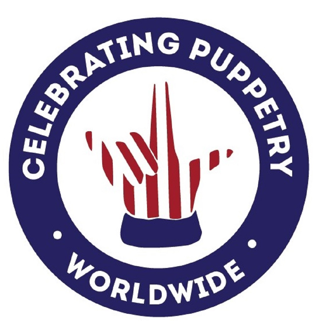 Logo with a puppet hand in the center, surrounded by a blue circle with white text, celebrating puppetry worldwide.