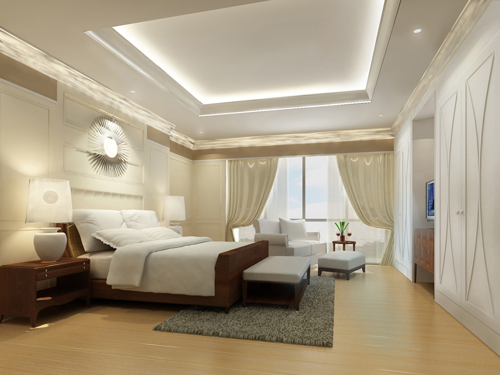 Luxurious bedroom with a large bed, nightstands, lamps, a sitting area by the window, and elegant decor.