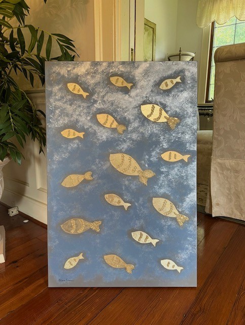 Painting of multiple goldfish swimming against a blue and gray cloudy background, displayed indoors on a wooden floor.