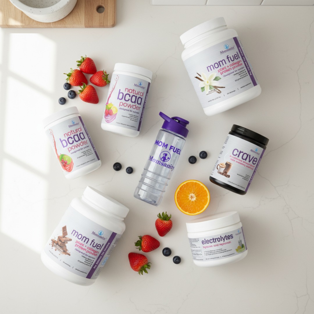 Supplements and a water bottle surrounded by strawberries, blueberries, and an orange half on a white surface.