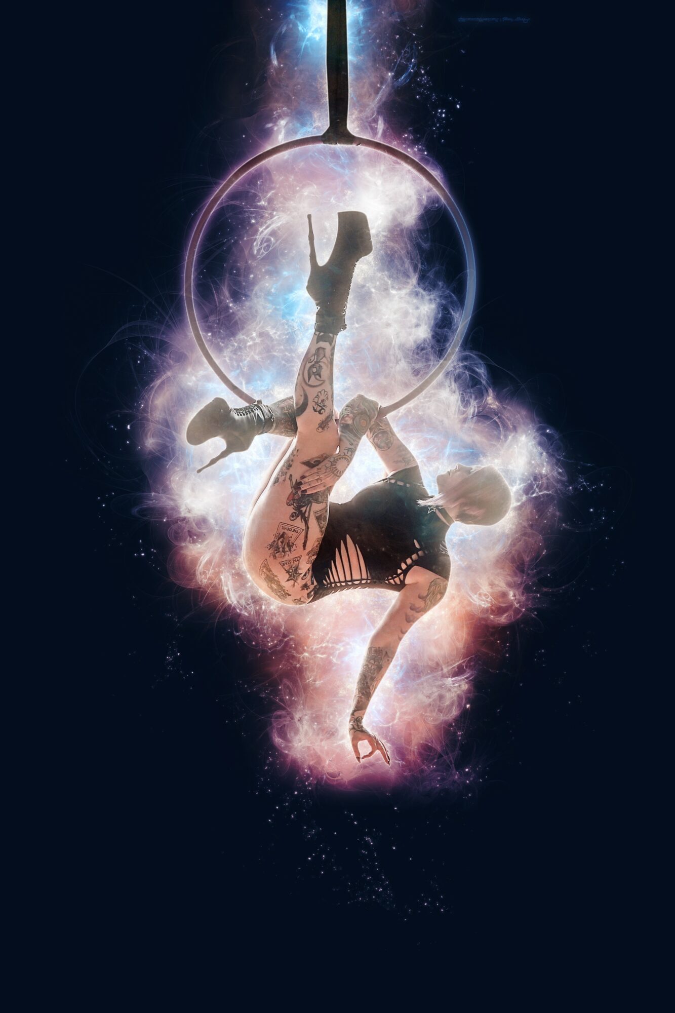 Person performing a handstand inside a glowing, cosmic light bulb with a starry background.