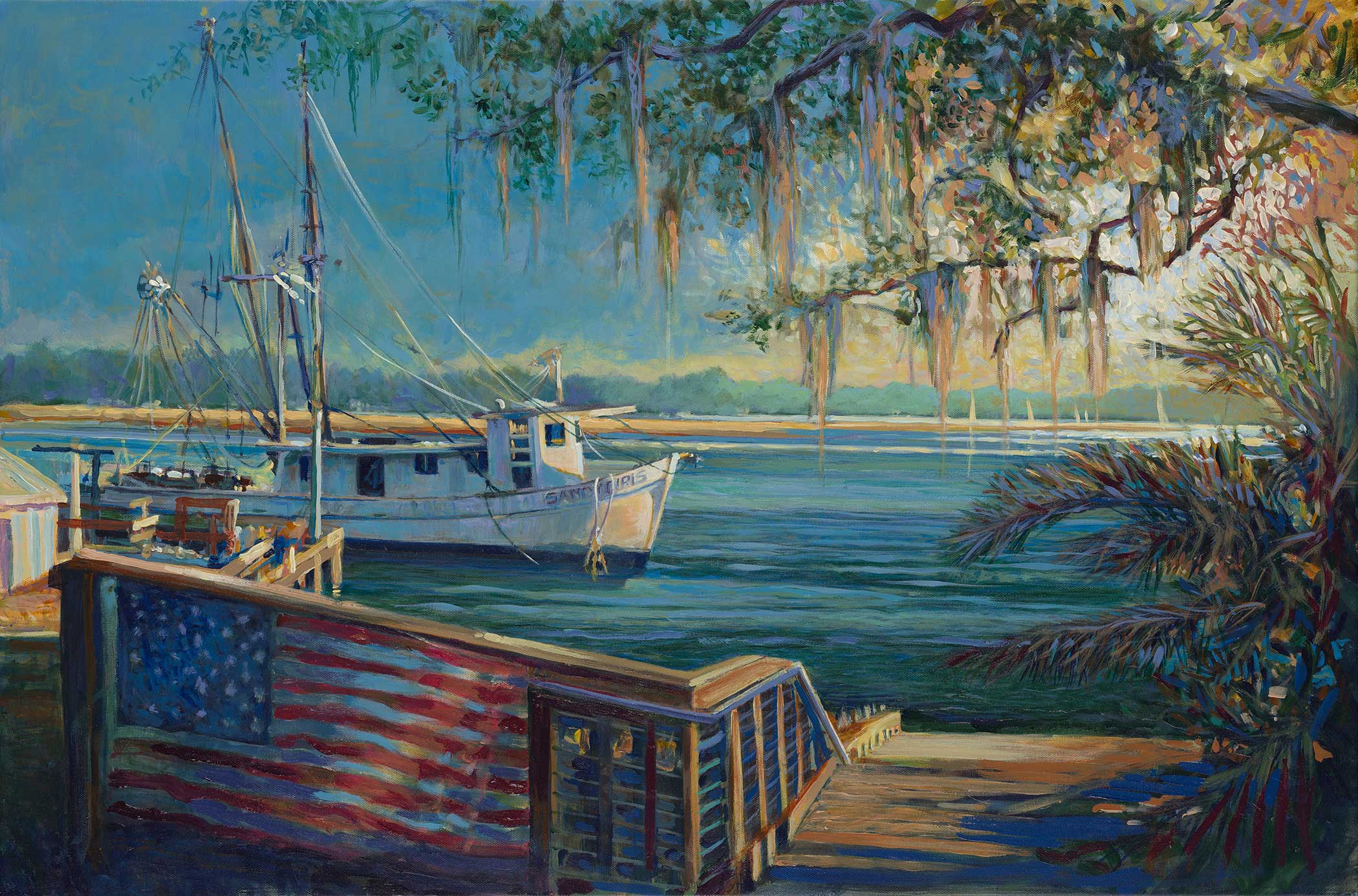A boat docked at a pier with an American flag painted on the railing, trees hanging moss, and water in the background.